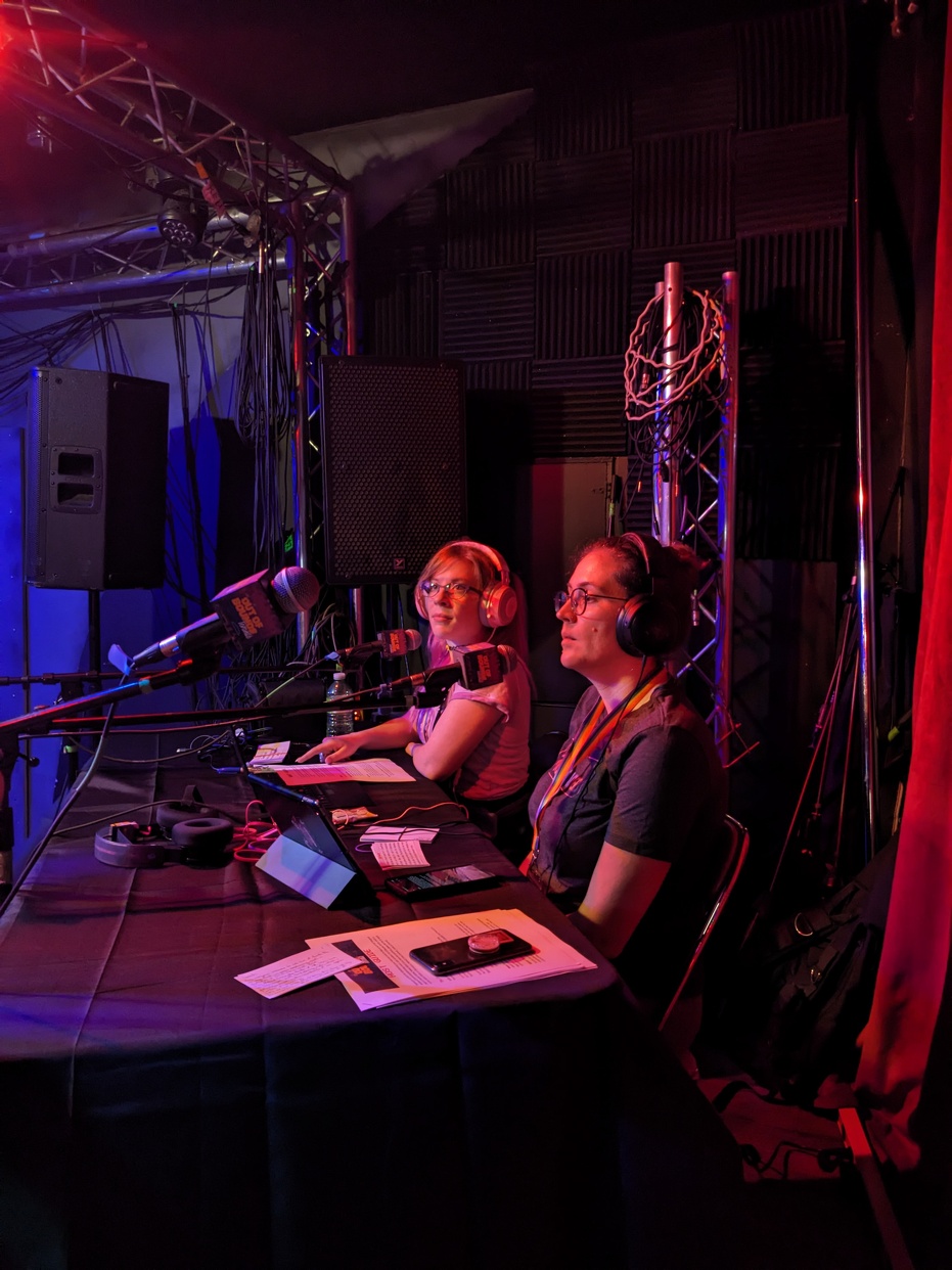 Two people sitting at a desk.